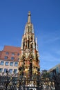 View of the `Schoner Brunnen` fountain in the historical town of Nuremberg, Germany