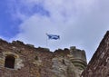 Saltire Flying over Historic Medieval Castle of Central Scotland Royalty Free Stock Photo