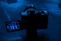 View through the screen of the video camera on the ice arena in blue light. The process of filming the ice surface with