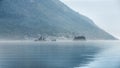 View on the sea bay of Kotor in Montenegro covered with early morning fog Royalty Free Stock Photo