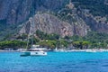 View from the sea of the bay and Mondello beach, catamaran anchored in the bay