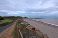 View of the sea and beach huts by the esplanade at Budleigh Salterton in Devon, England Royalty Free Stock Photo