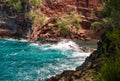 View of sea beach with waves and rocky coast. Red Sand Beach, Maui in in Hawaiian. Royalty Free Stock Photo