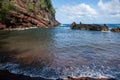 View of sea beach with waves and rocky coast. Red Sand Beach, Maui in in Hawaiian. Royalty Free Stock Photo