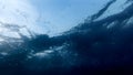 View from the sea bottom on water ripples and rising air bubbles under the sea water surface Royalty Free Stock Photo