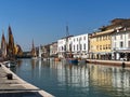 View of a sea canal with sailing boats in a small ancient city Royalty Free Stock Photo