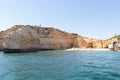 View from the sea of Carvoeiro beach. The Lagoa region has a coastline formed of towering cliffs, turquoise waters and picturesque