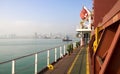 View of the sea and city beach from the port quay. Industrial po Royalty Free Stock Photo