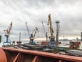 View of the sea and city beach from the port quay. Industrial po