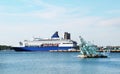 View of the sea ferry moored to the pier on a clear sunny day. Travel