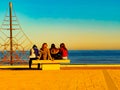 View on sea and girls who siting on the seat in Peniscola town