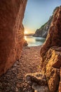 view of the sea in the sunrise, hidden stone beach at Vibnik Krk in Croatia