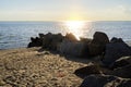 View of the sea with rocks and orange sky. Rock formation in coastal water in Thailand Royalty Free Stock Photo