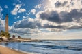 View of sea, sky with clouds and Maspalomas lighthouse Royalty Free Stock Photo