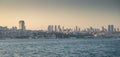 View from the sea to Istanbul at sunset. The coastline with old and new houses in the vicinity of the city. Summer panoramic