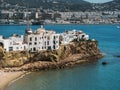 View from the sea to old white houses on the rock on a sunny day. Port of Ibiza, Balearic islands, Spain. Royalty Free Stock Photo