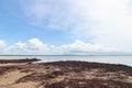 View of sea waves shore and fantastic rocky beach coast on the island and background sky with mountain Royalty Free Stock Photo