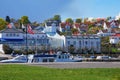 A view of sea yachts in the harbor and residential houses and other buildings in the small port town of Asgardstrand, Norway Royalty Free Stock Photo