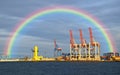 View of seaport with rainbow on background