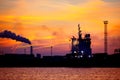 View on seaport with ship silhouette at sunset. Evening panorama of the cargo port Royalty Free Stock Photo