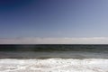 A view of a seascape, Pacific ocean, waves and foams and splash in Malibu, California Royalty Free Stock Photo