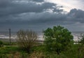 View of the seashore on a cloudy rainy day