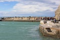 View on seaside, people on the stone pier, Monterosso, Cinque Terre, Italy Royalty Free Stock Photo