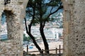 Tossa de Mar, Spain, August 2018. View of the seaside town through the doorway in the medieval fortress wall.
