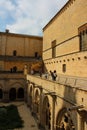 View from the second floor of the courtyard and stone carved arches of the Poblet monastery cat. Reial