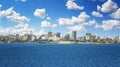 View of the Senegal capital of Dakar, Africa. It is a city panorama taken from a boat. There are large modern buildings