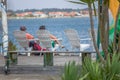 View of a senior couple sitting on a lounger enjoying the view of Aveiro River