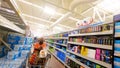 View of a seniorwearing a face mask in a mart cart