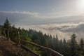 View from  Serak in Jeseniky mountains on a summer foggy morning and  sea of clouds around mountain peak Royalty Free Stock Photo