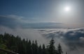 View from  Serak in Jeseniky mountains on a summer foggy morning and  sea of clouds around mountain peak Royalty Free Stock Photo