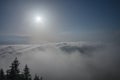 View from  Serak in Jeseniky mountains on a summer foggy morning and  sea of clouds around mountain peak Royalty Free Stock Photo