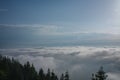 View from  Serak in Jeseniky mountains on a summer foggy morning and  sea of clouds around mountain peak Royalty Free Stock Photo