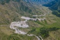 View of Serpentine Road Among Green Hills of Chike-Taman pass in Altai Mountains. Asphalt road going through cliff Royalty Free Stock Photo