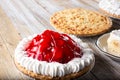 dessert pies on wood table surface, strawberry cream pie