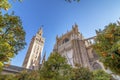 View of Seville Cathedral of Saint Mary of the See Seville Cathedral  with Giralda tower and oranges trees in the foreground Royalty Free Stock Photo