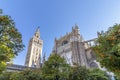 View of Seville Cathedral of Saint Mary of the See Seville Cathedral  with Giralda tower and oranges trees in the foreground Royalty Free Stock Photo