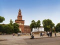 View of the Sforza castle in Milan with a fountain in the foreground in the Castle square in the historical center