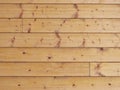 Glazed spruce planks in wall joined with tongue and groove