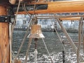 View of ship's bell on an old yacht wooden  clasic  ship Royalty Free Stock Photo