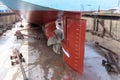 View on the ships rudder and propeller. Ship in a dry dock.