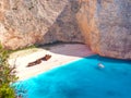 View on Shipwreck beach in amazing bay, boat and ship with swimming people in Ionian Sea blue water Blue Caves. Greece islands Zak Royalty Free Stock Photo