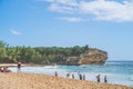 View of Shipwreck beach as Tourists enjoy the pacific ocean in Poipu. Royalty Free Stock Photo