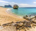 A view of a shipwreck on Governors beach on Grand Turk with the Cruise terminal in the background Royalty Free Stock Photo