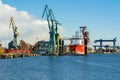 View of the shipyard with historical cranes in the industrial part of the city Gdansk GdaÃâsk in Poland Polska. The shipyard is