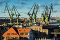 View of the shipyard and port - industry part of the city of Gdansk GdaÃâsk with shipyard constructions and cranes. Poland