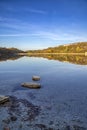 fall foliage colors reflected in still lake water Royalty Free Stock Photo